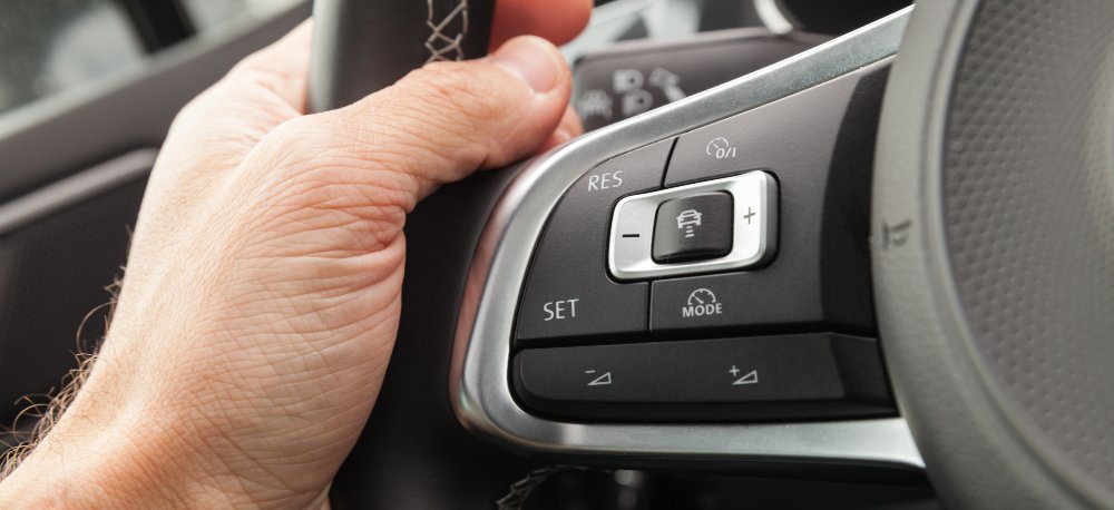 https://www.gerbercollision.com/includes/uploads/Articles/Adaptive-Cruise-Control-on-a%20steering-wheel.jpg